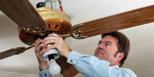 electrician removing ceiling fan