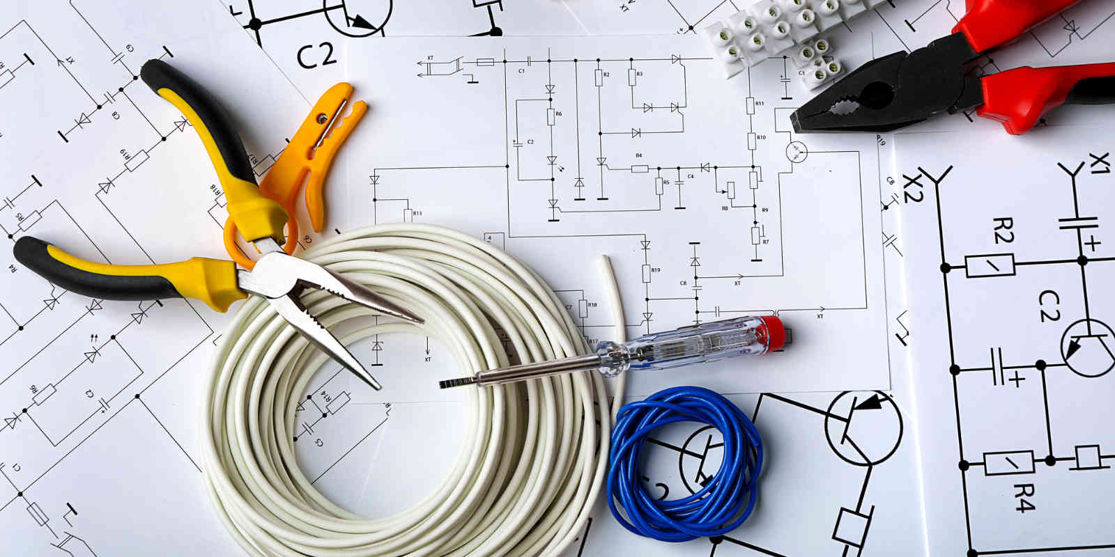 electrical tools on circuit drawing background